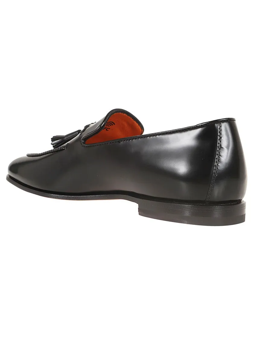 Black Leather Moccasin With Tapered Toe And Decorative Tassels