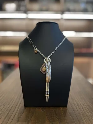 Goros Gold Tip Feather with Leather Cord Setup